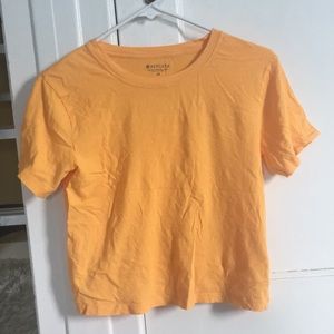 Bright orange Athleta flowy cropped tee